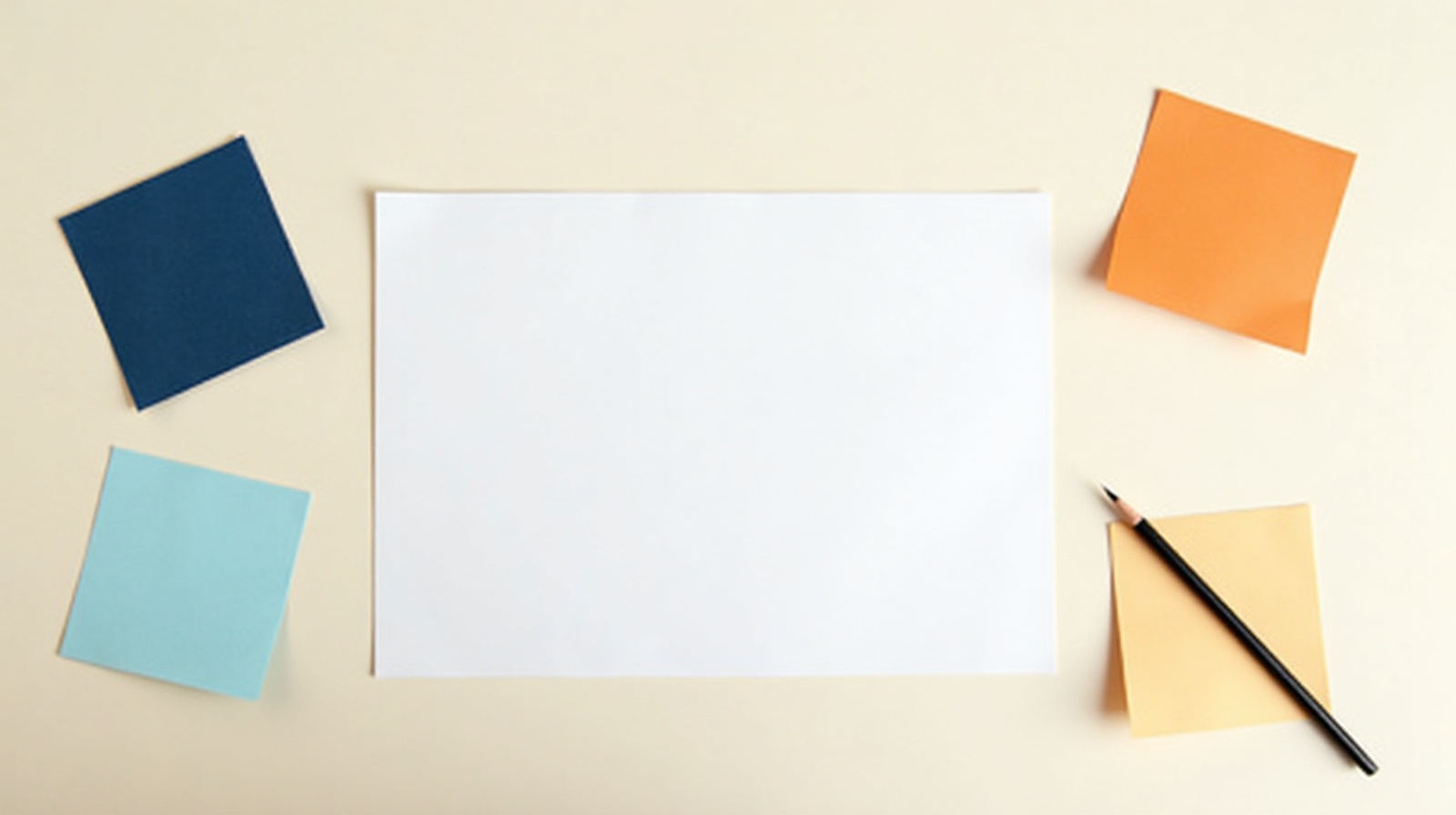 Blank paper with sticky notes and a pencil, representing the planning process for writing an About page